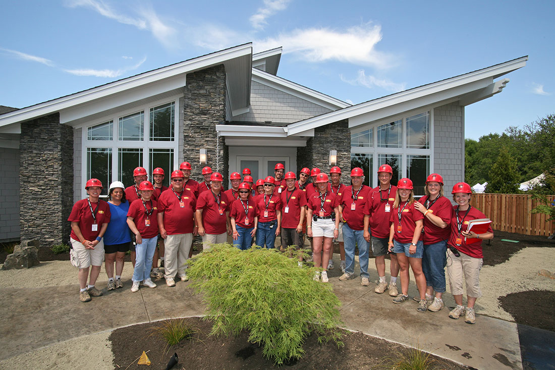 Extreme Makeover: Home Edition - Legend Team outside the Byers' new home